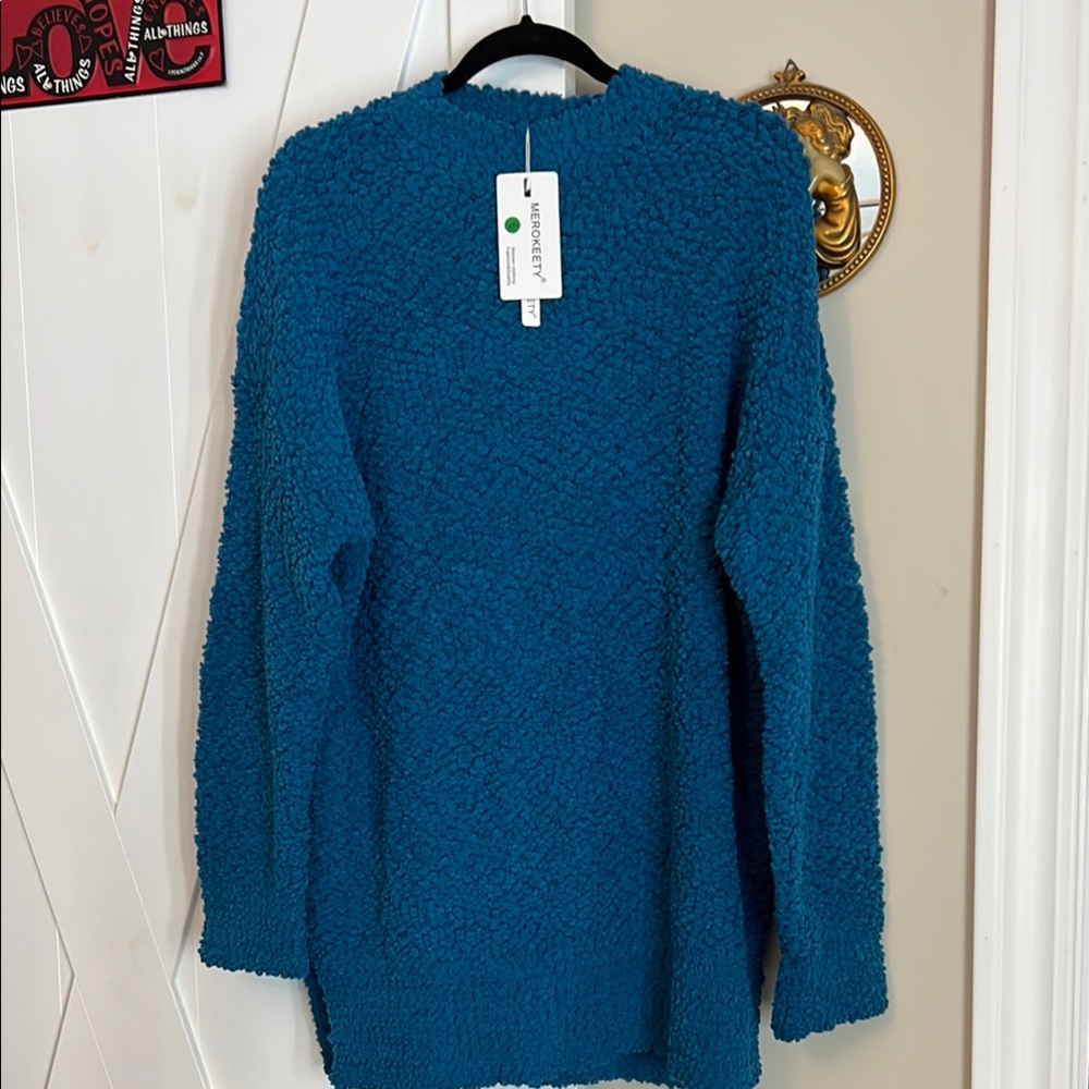 Blue Sweater super comfy, NWT totally relaxed fit.